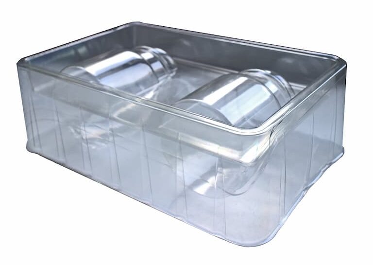 A clear vacuum formed tray for candles.