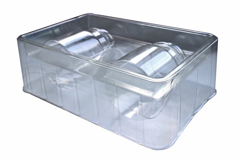 A clear vacuum formed tray for candles.