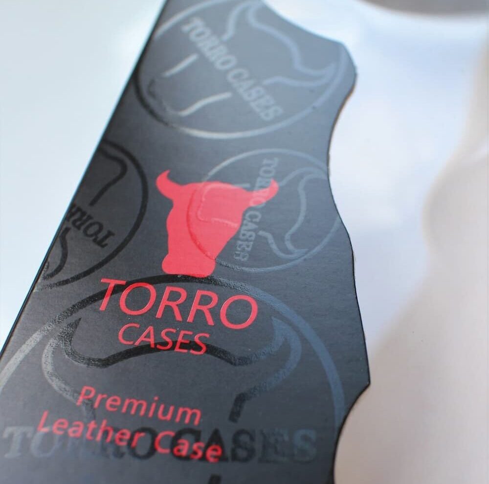A box for a Toro Phone Case with a cut out window in the shape of a bulls head.